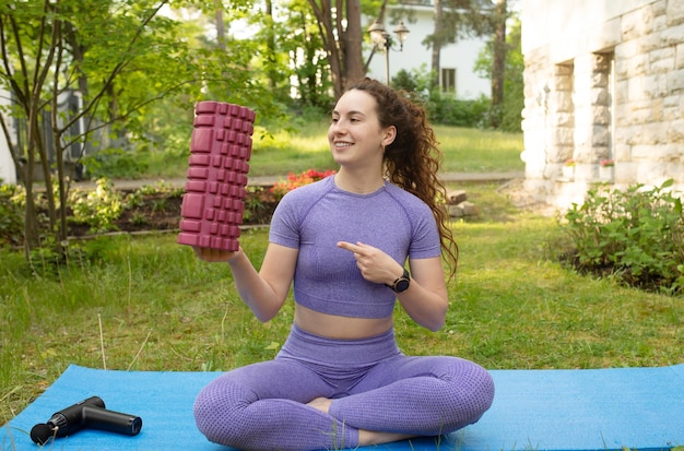 A woman in a purple top holds a box of cubes that says'i'm a girl '