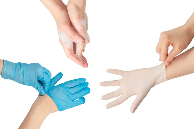 Woman puts on white rubber gloves