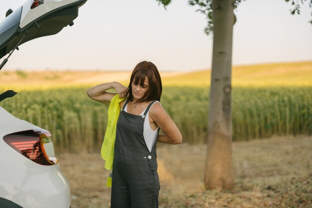 Woman putting on reflective vest