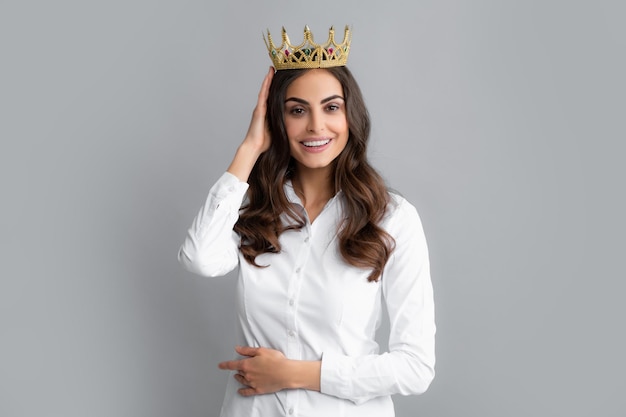 Woman queen Portrait of ambitious girl with crown feeling princess confidence Studio shot isolated