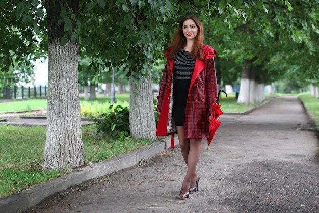 Woman in a raincoat and an umbrella