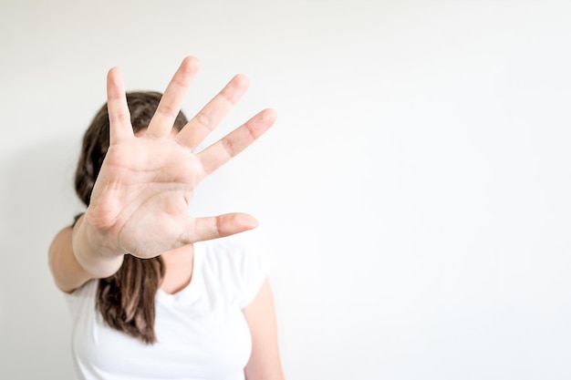 Woman raised her hand for dissuade campaign stop violence against women International Women's Day