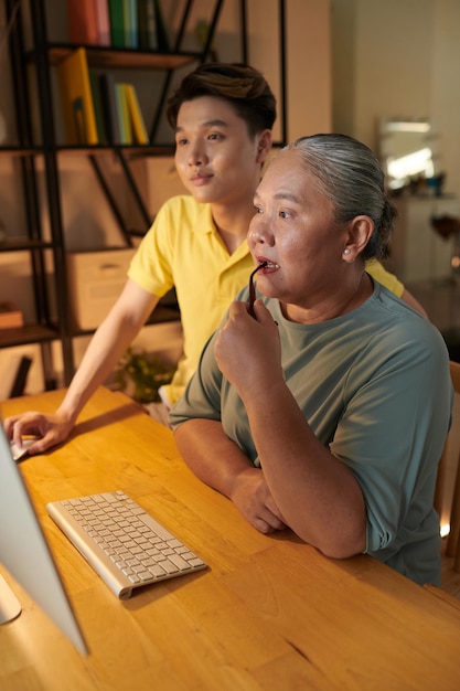 Woman reading Article on Computer