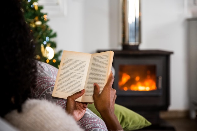 Woman reading book in cozy room