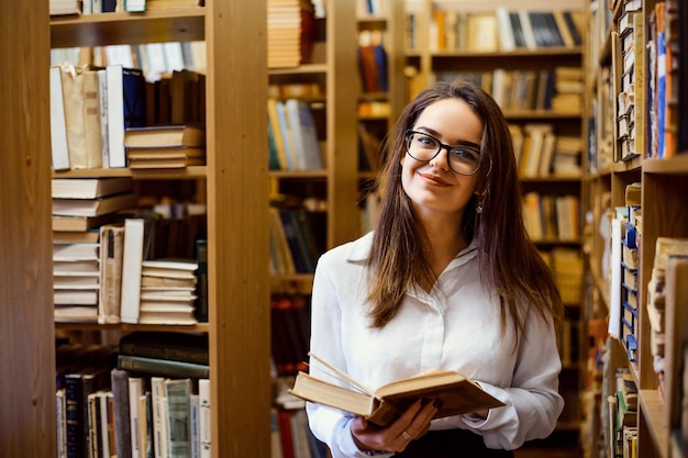 Woman reading a book in the library