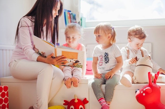 Woman reading to kids in school