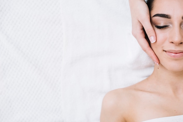 Woman receiving a relaxing facial massage