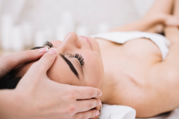 Woman receiving a relaxing facial massage