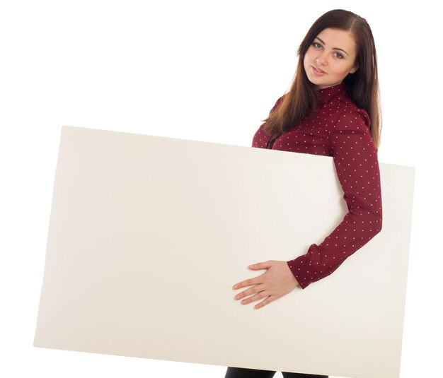 Woman in red blouse is holding a blank canvas