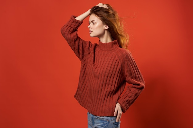 Woman in a red sweater beautiful hairstyle fashion lifestyle closeup