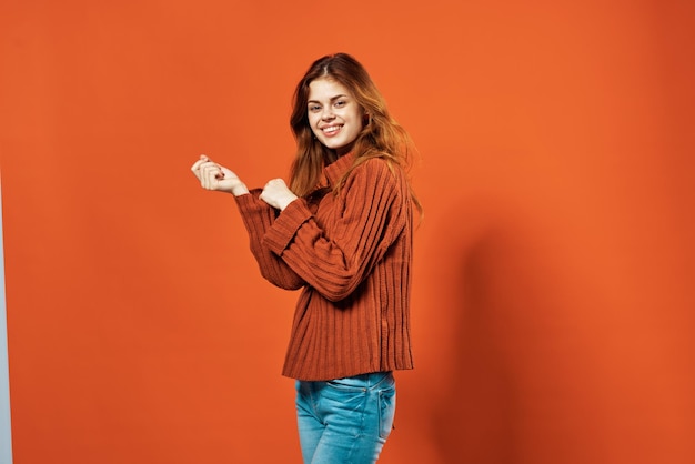 Woman in red sweater decoration studio red background