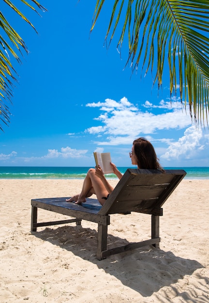 Woman relaxes on beach