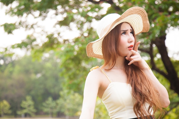 Woman relaxing in the park during the holidays.