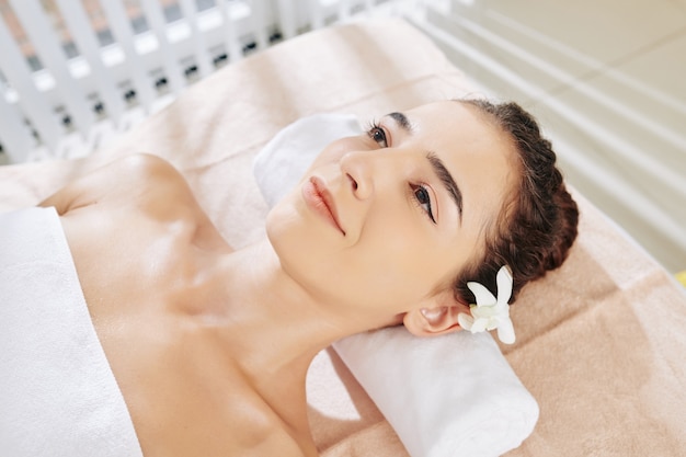 Woman relaxing in spa salon