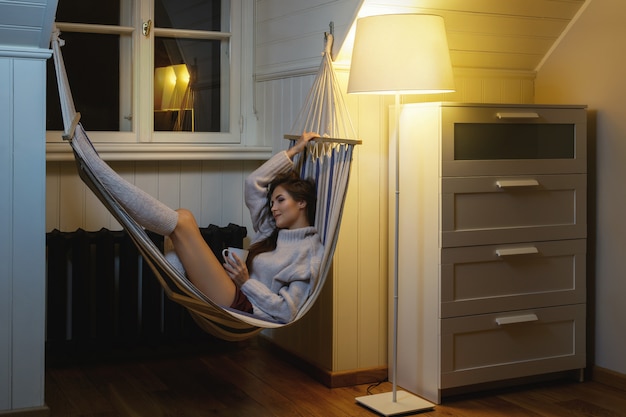 Woman relaxing with a cup of hot drink