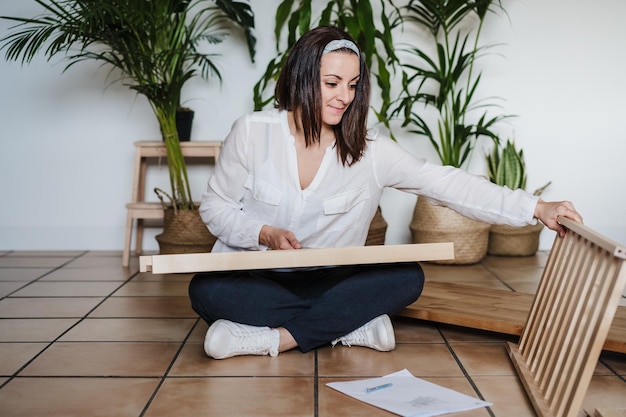 Woman repairing furniture at home