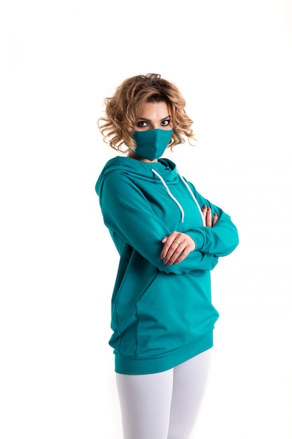 Woman in respiratory mask and blue sweatshirt