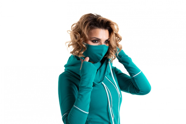 Woman in respiratory mask and blue sweatshirt