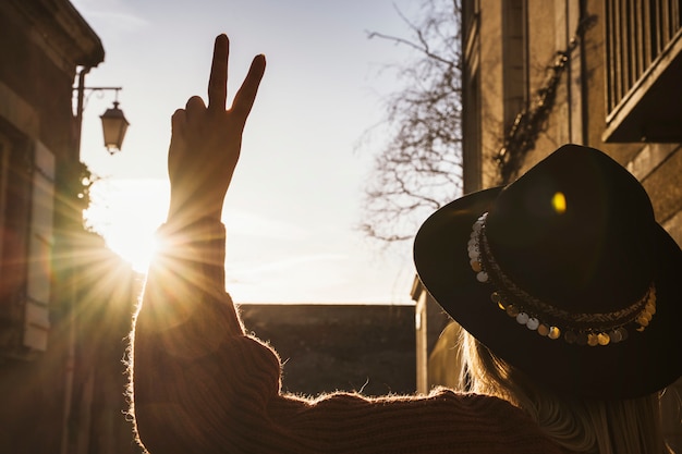 Woman rising her hand with symbol of ok and good feelings