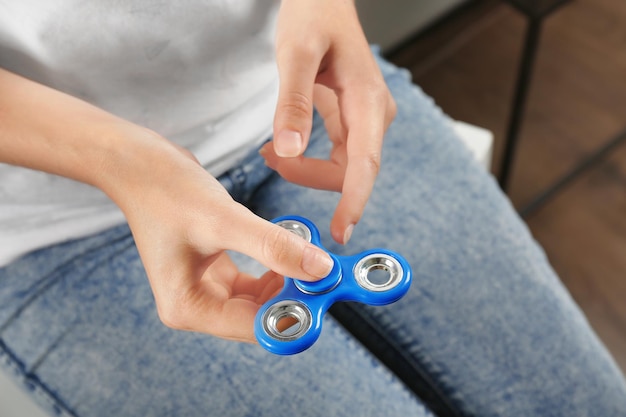 Woman rolling modern spinner indoors