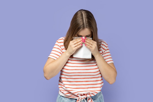 Woman rubbing eyes crying because of hopelessness and loneliness nervous breakdown