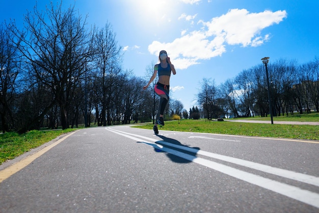 Woman runners morning exercise she wears a nose mask. Protection against dust and viruses