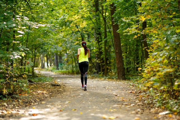 Woman running at forest