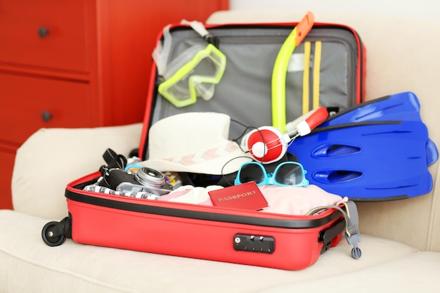 Woman's clothes in a red suitcase close up