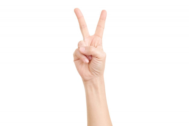 Woman's hand showing the sign of victory and peace close-up.