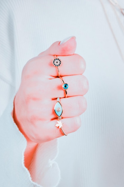 A woman's hand with a ring that says'aquamarine'on it