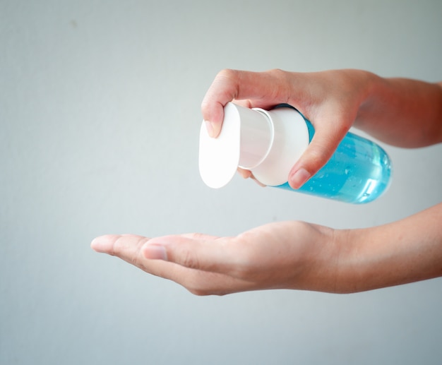 A woman's hands are washing their hands with alcohol gel to kill the Coronavirus