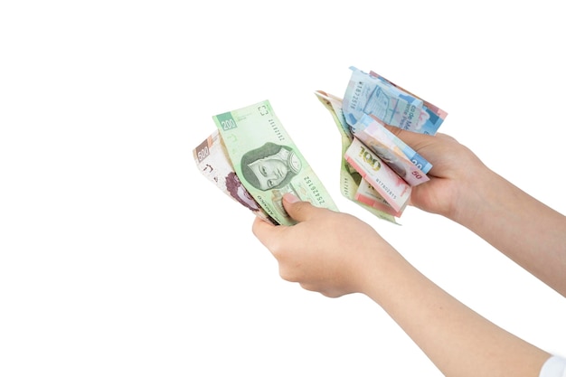 Woman's hands count bills of Mexican pesos with white background