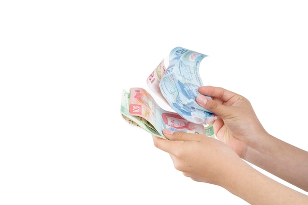 Woman's hands counting money on white background