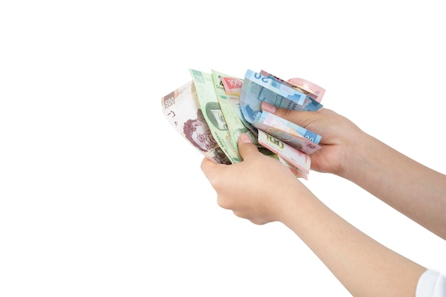 Woman's hands counting money on white background