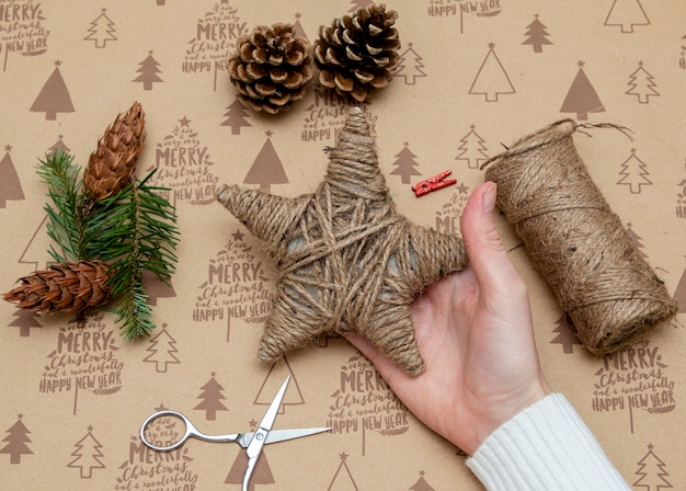 Woman's hands making a Christmas ornament