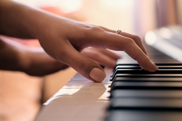 Woman's hands playing the piano