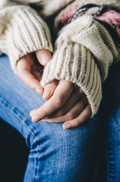 Woman's hands in sweater