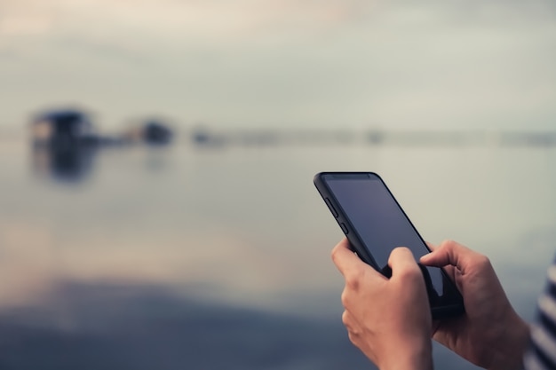 Woman's hands using a smartphone