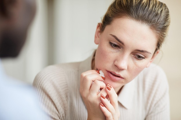 Woman saddened by loss at therapy session