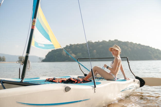 Woman on sailboats. Sailing yacht, regatta.