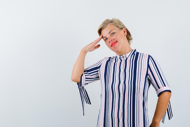 Woman saluting on white background