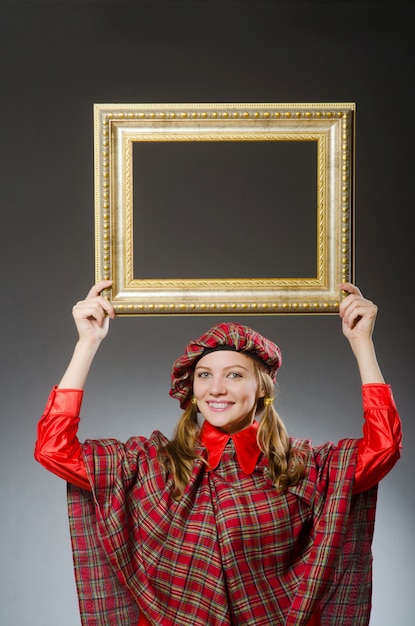 Woman in scottish clothing in art concept