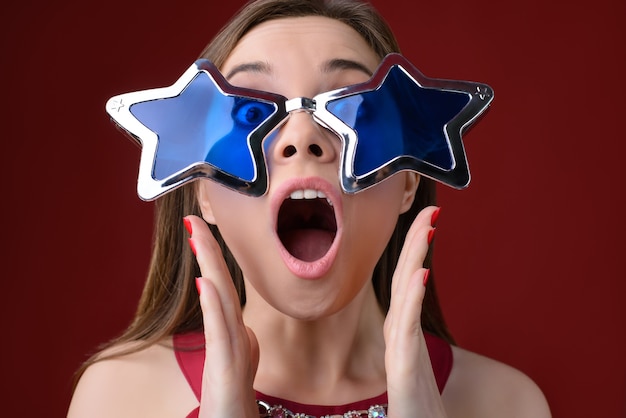 Woman screaming holding hands near her mouth