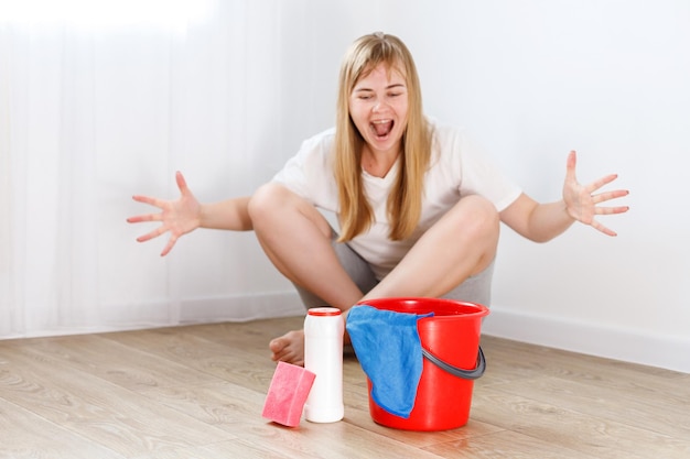 A woman screams at cleaning detergents in the house