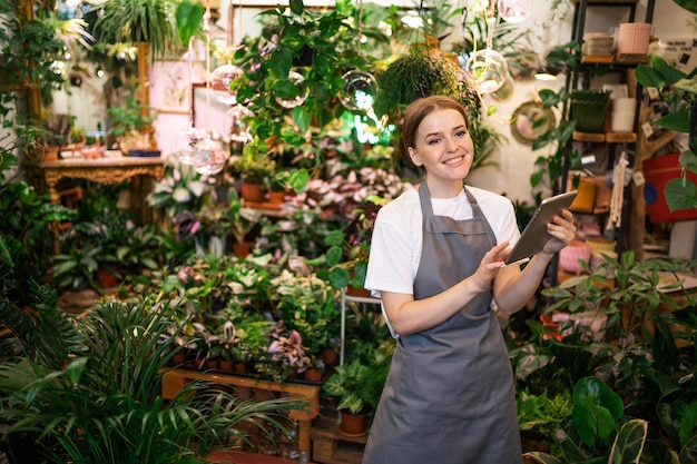 A woman sells flowers to a small business Employee surf the internet information browser