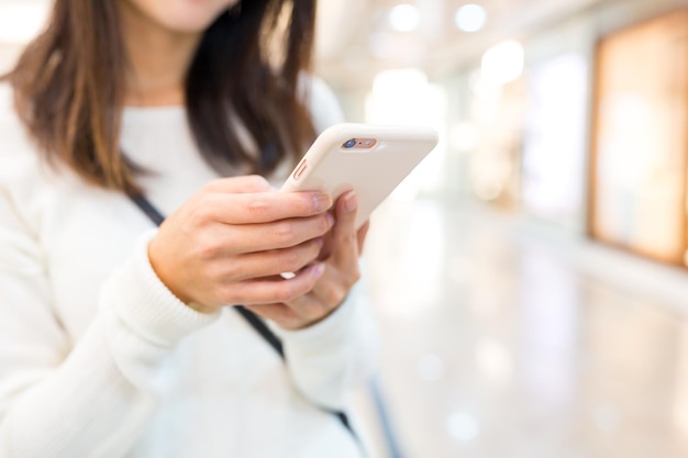 Woman sending text message on mobile phone