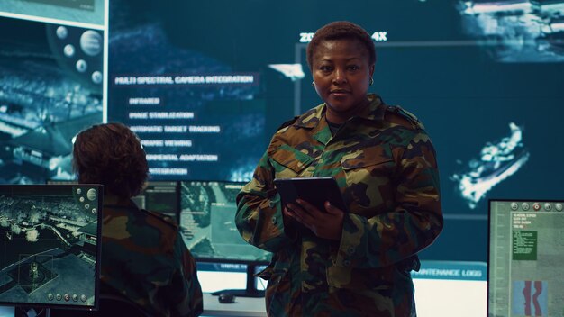 Woman sergeant major working on deployment of electronic warfare tools