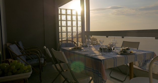 Woman serving dinner on the home balcony