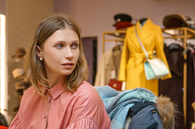 Woman shopper in a clothing store