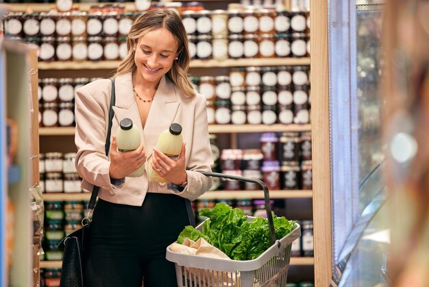 Woman shopping and organic milk for diet health or nutrition in store supermarket or grocery shop Happy vegan girl and sale of product in retail discount or promotion sales for wellness food